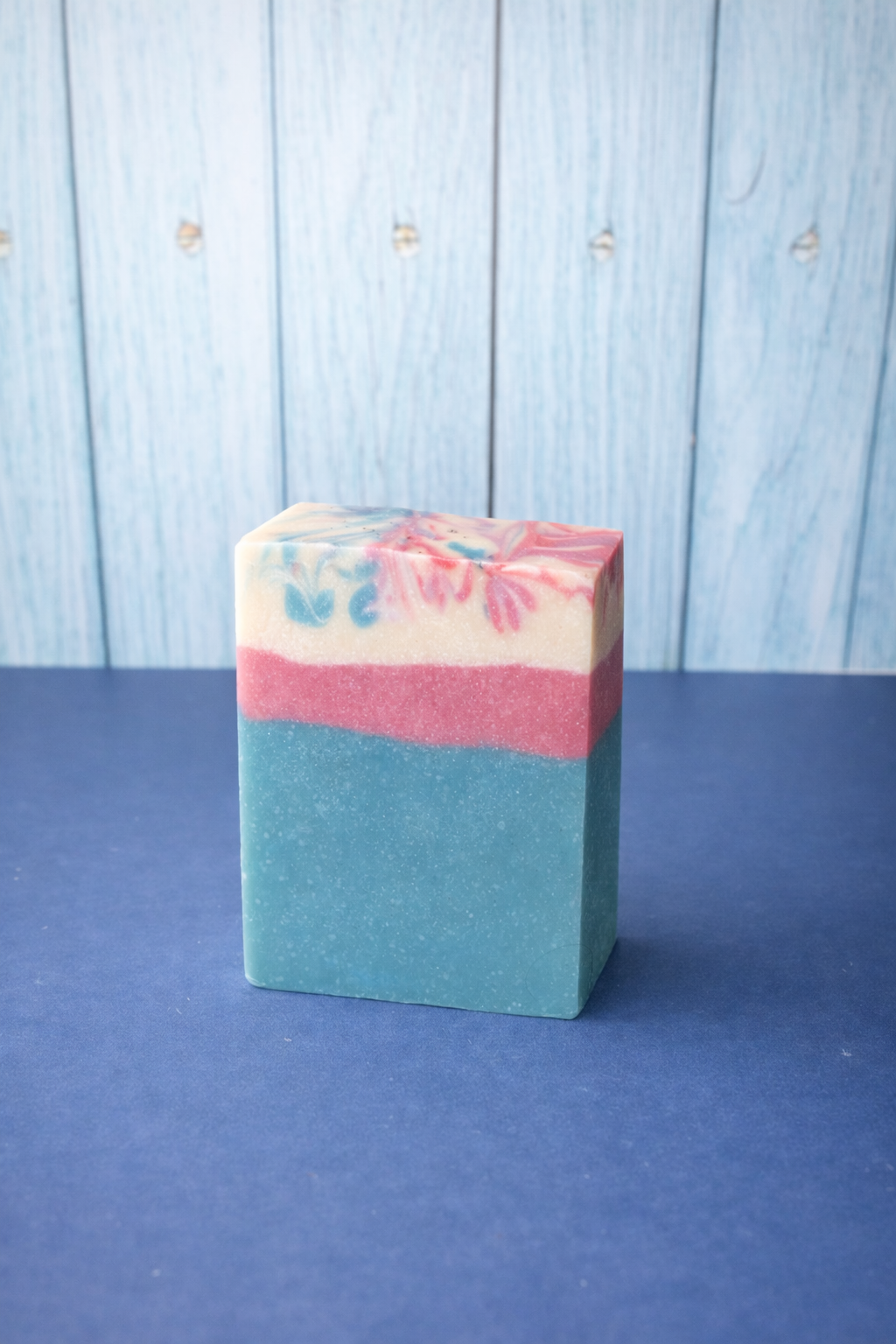 Press & Ready Goat milk soap Bar on blue surface background