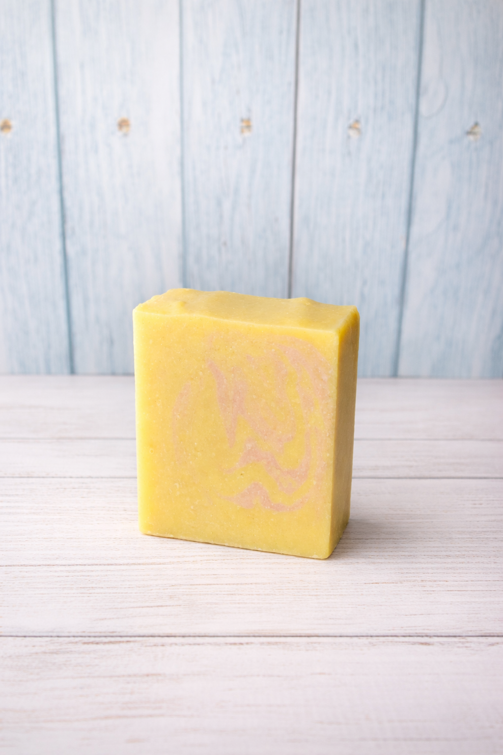 Main Squeeze Energy Goat Milk Soap Bar on light colored background 