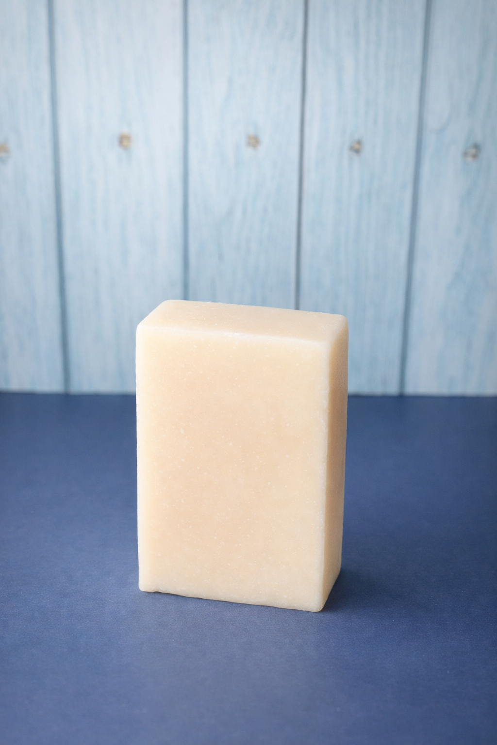No Added Drama Goat Milk Soap Bar on Blue surface 