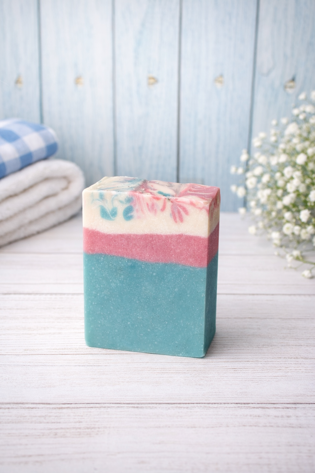 Pressed & Ready Goat milk soap bar On wooden surface with styled spa background